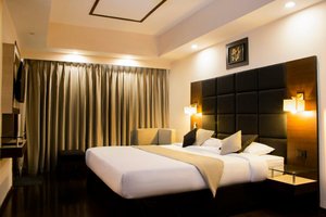Hotel Alpine Continental in Shillong, image may contain: Hotel, Building, Resort, Interior Design