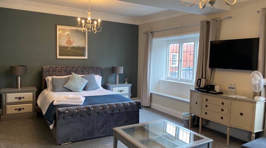 Family room, complete with king size bed and sofa bed accommodating up to four people. This room has a large en-suite shower room.