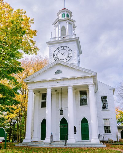 Historic white church in Kennebunkport, Maine, on a cloudy day in Autumn 