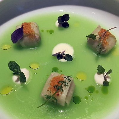 Mediterranean dish with green broth and cream