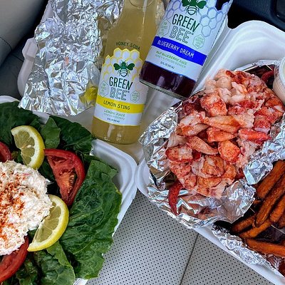 Crab salad over greens, lobster, and sweet potato fries