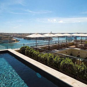 The Gomerino Hotel in Island of Malta, image may contain: Waterfront, Pool, Hotel, Resort