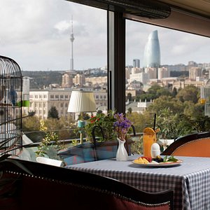 The restaurant "Societe"located on the top floor of the hotel, immediately strikes you with its view