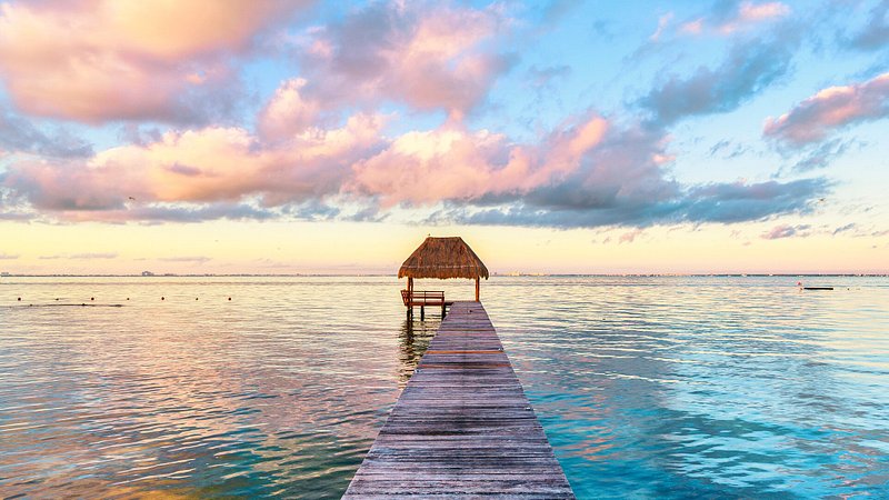 Palapa and wooden pier in Isla Mujeres, Mexico