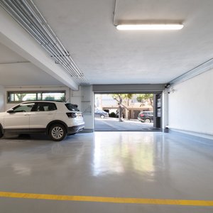 Underground garage and EV chargers, accessible by a lift.