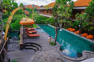 Fourteen Roses Boutique Hotel in Kuta, image may contain: Hotel, Resort, Pool, Villa