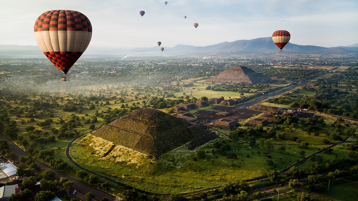 Hot air balloons flying in the sky at Teotihuacan 