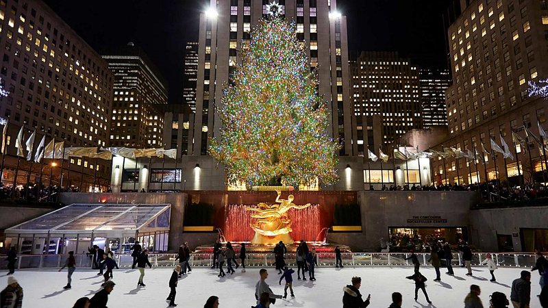 Ice skating under the Christmas tree at The Rink at Rockefeller Center in New York