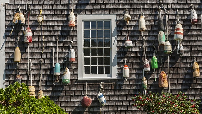 House decorated with lobster buoys in Provincetown, MA