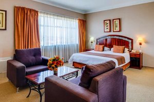 Bulawayo Rainbow Hotel in Bulawayo, image may contain: Couch, Furniture, Home Decor