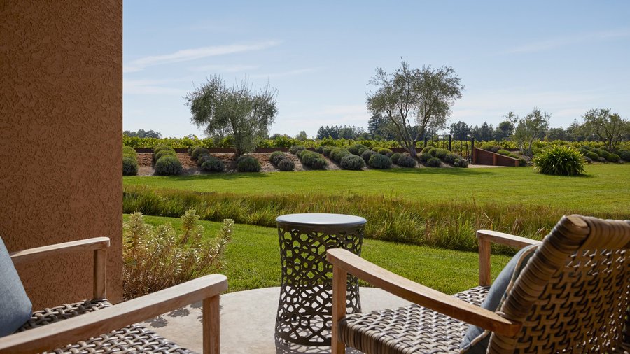 Furnished patio on the ground floor of Vintners Resort's guest accommodations, overlooks lavender fields and the vineyard.