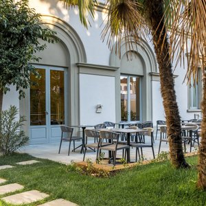 Ariele Hotel in Florence, image may contain: Floor, Flooring, Table, Foyer