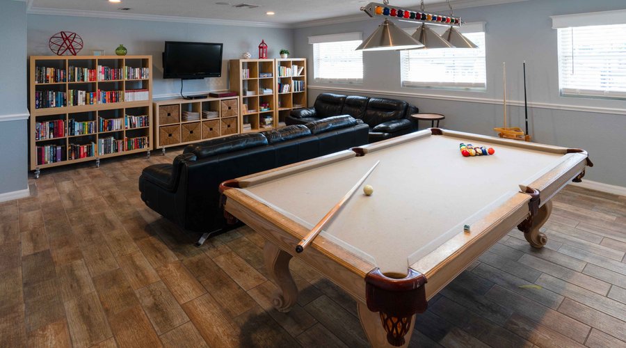 Billiards and community lounge with TV.
