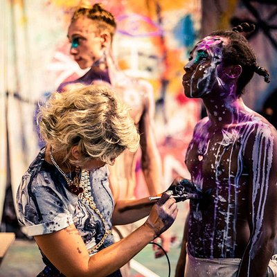 29 rooms NYC exhibition: Performer getting his costume spray-painted 