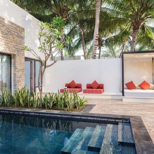 One Bedroom Garden View Pool Villa pool and outdoor seating area