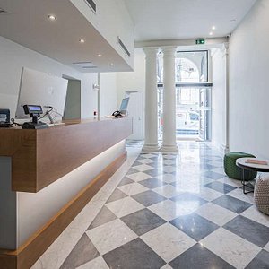 Ariele Hotel in Florence, image may contain: Floor, Flooring, Table, Foyer