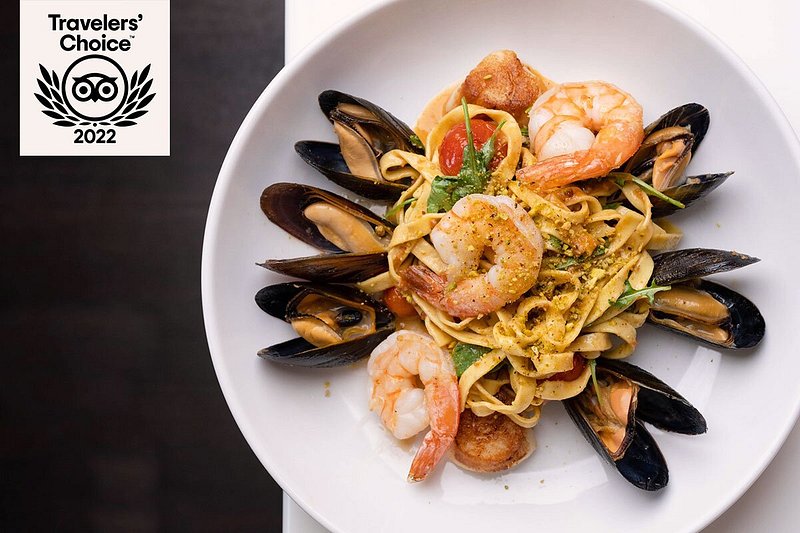 Large bowl with pasta, shrimp, and mussels