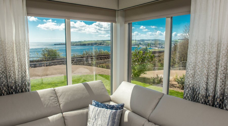 Open plan living room with views down to Stonehaven Bay