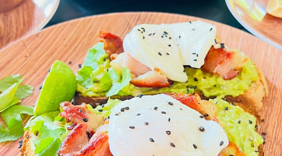 Guacamole, bacon and poached egg toast