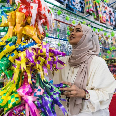 Muslim lady admiring Hari Raya decorations