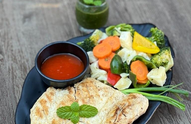 Grilled chicken breast with sauted vegetables