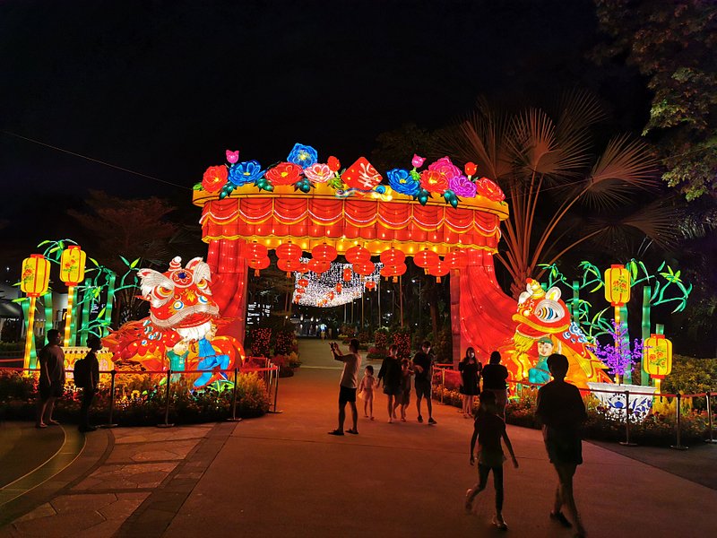 People viewing glowing CNY lanterns 