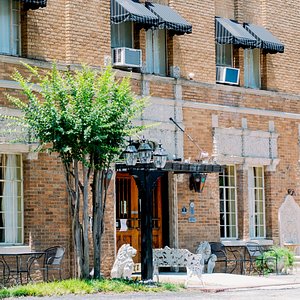 The Faust Hotel in New Braunfels, image may contain: Brick, Neighborhood, City, Awning
