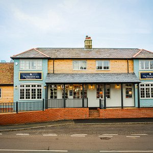 Modern country pub, with large beer garden and covered outside seating.