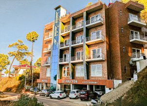 Hotel Le Halcyon in Shai, image may contain: City, Urban, High Rise, Apartment Building