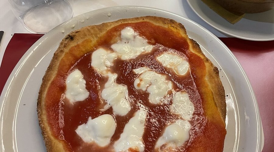 Frittaré pizza - pizza made with double cooking, firstly fried then cooked in the oven with tomato sauce and buffalo mozzarella 