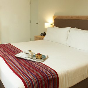 Hotel Estelar San Isidro in Lima, image may contain: Furniture, Bed, Cushion, Plate