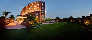 Radisson Blu MBD Hotel Noida in Noida, image may contain: Resort, Hotel, Grass, City