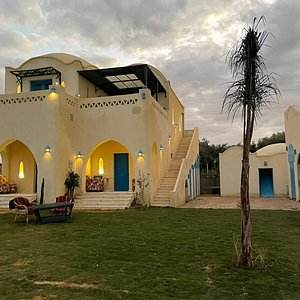 Lake House By Tunisia Green Resort in Al Fayyum, image may contain: Villa, Housing, Hotel, Hacienda