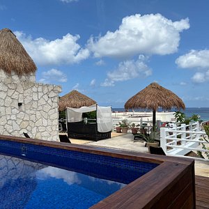 Flamingo Hotel in Cozumel, image may contain: Resort, Hotel, Hut, Villa