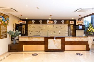 Golden Tulip Westlands Nairobi in Nairobi, image may contain: Table, Interior Design, Indoors, Foyer