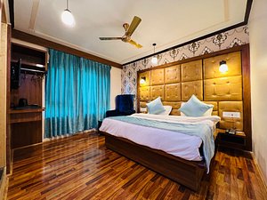 The Shelter Heritage A Boutique Hotel in Srinagar, image may contain: Interior Design, Wood, Hardwood, Ceiling Fan