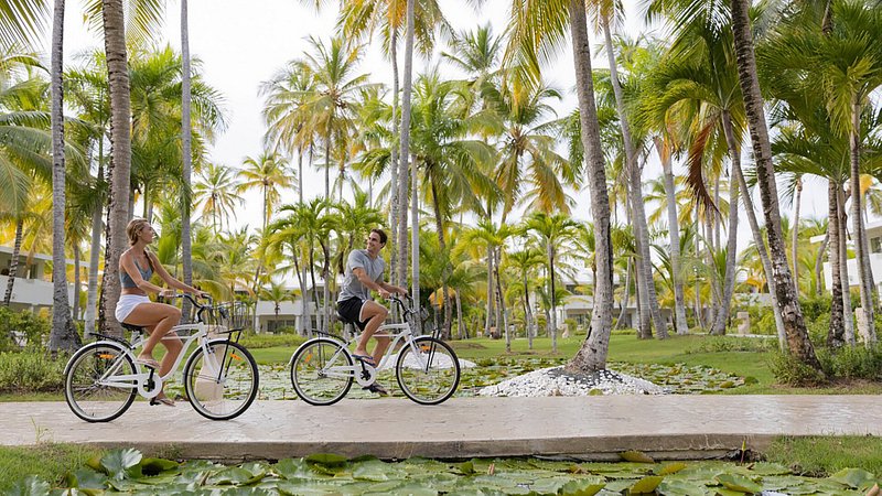 Couple bike riding at Melia Punta Cana Dominican Republic