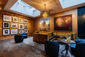 Hotel Lucia in Portland, image may contain: Reception Room, Home Decor, Living Room, Chandelier