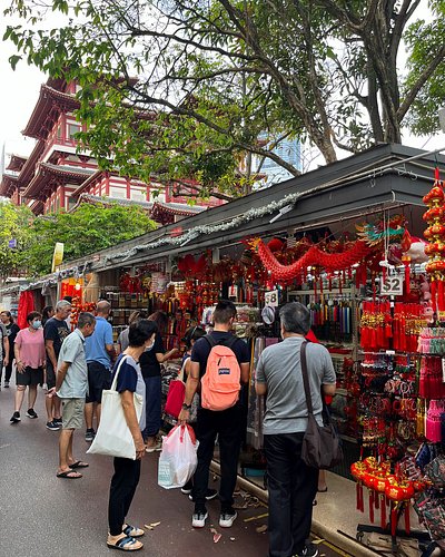 Shopping in Singapore’s Chinatown with view of Buddha Tooth Relic Temple
