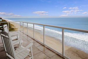 The Lucie in Jensen Beach, image may contain: Balcony, Building, Chair, Furniture