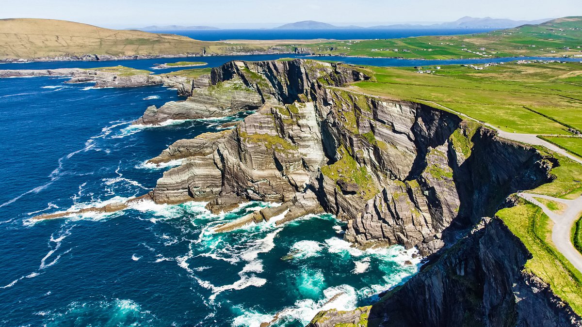 Waves crashing over Kerry Cliffs in County Kerry, Ireland