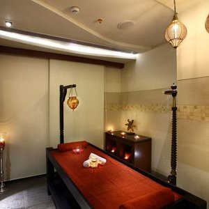Mahagun Sarovar Portico Suites in Ghaziabad, image may contain: Lighting, Table, Furniture, Indoors