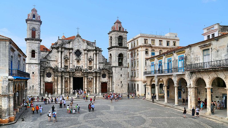 Tourists in the busy Plaza De La Catedral in Havana, Cuba