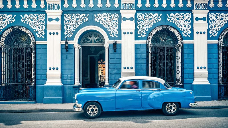 Classic car on a vibrant  street in Camagüey, Cuba 