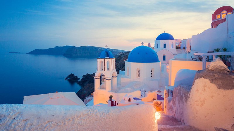 Churches in Santorini, Greece at sunset