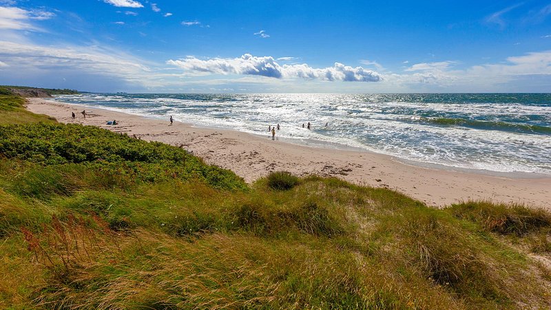 Scenic view of beach against sky in Bornholm, Denmark