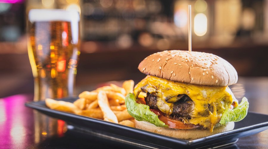 Works Burger 
Juicy beef pattie, grilled bacon, fried egg, grilled onions, melted cheese in a toasted bun with tomato and salad greens.
served with chips