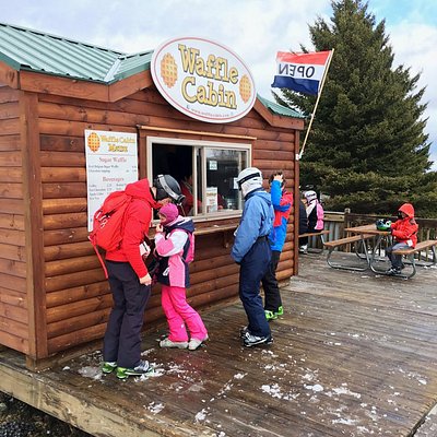 A group of skiers outside of Waffle Cabin in Killington, Vermont