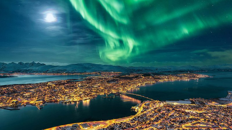 Aurora Borealis dancing over the city of Tromso, Norway 