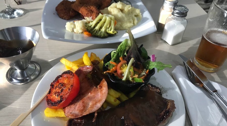 Crumbed Cutlets & Vegies, and Steak Dianne with Chips & Salad.